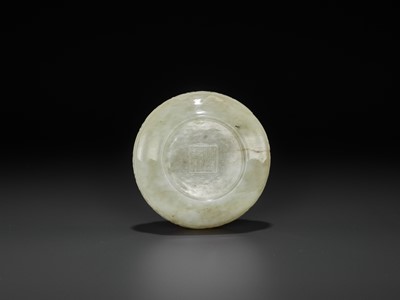 Lot 113 - A PALE CELADON JADE ‘ARCHAISTIC’ WASHER, EARLY QING DYNASTY