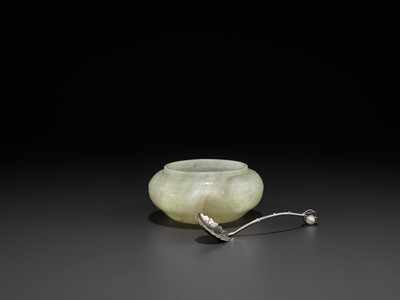 Lot 113 - A PALE CELADON JADE ‘ARCHAISTIC’ WASHER, EARLY QING DYNASTY