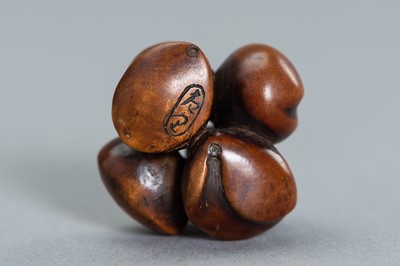 Lot 475 - TWO IVORY AND WOOD NETSUKE OF LEGUMES AND NUTS