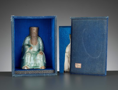 Lot 747 - A LONGQUAN CELADON AND BISCUIT FIGURE OF AN IMMORTAL, MING DYNASTY