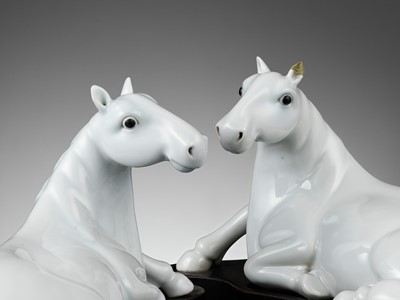 Lot 810 - A PAIR OF WHITE-GLAZED FIGURES OF HORSES, QING DYNASTY