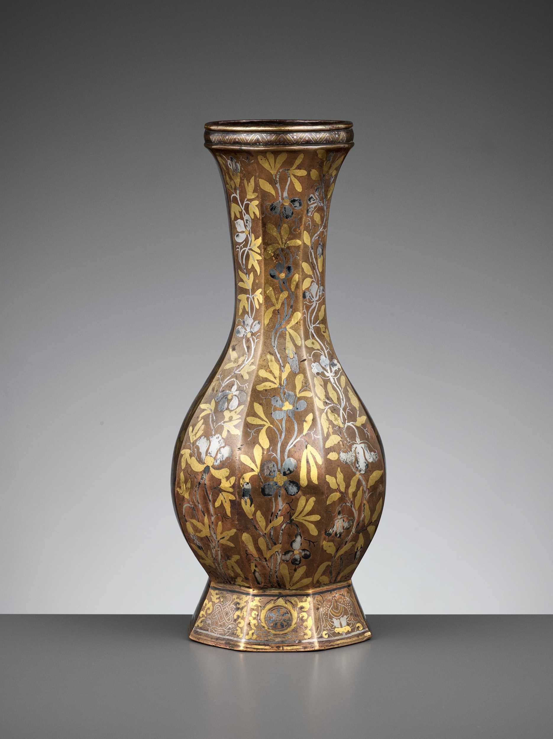 Lot 348 - A ‘BAJIXIANG’ SILVER- AND GOLD-INLAID BRONZE OCTAGONAL VASE, MING DYNASTY