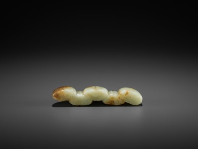 Lot 81 - A CELADON AND RUSSET JADE ‘FIVE PEACHES’ BRUSH REST, MING DYNASTY