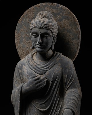 Lot 1245 - A LARGE GRAY SCHIST STATUE OF BUDDHA SHAKYAMUNI