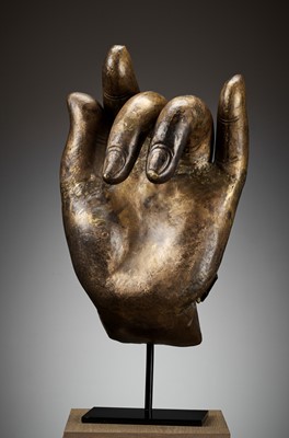 Lot 402 - A MASSIVE LACQUER-GILT COPPER REPOUSSÉ ‘KARANA MUDRA’ HAND OF BUDDHA, MING TO EARLY QING