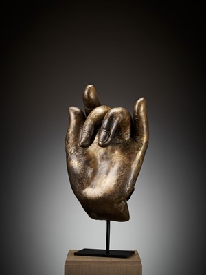 Lot 402 - A MASSIVE LACQUER-GILT COPPER REPOUSSÉ ‘KARANA MUDRA’ HAND OF BUDDHA, MING TO EARLY QING