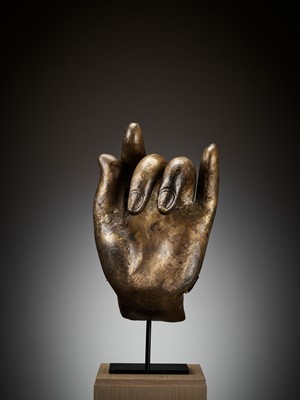 Lot 402 - A MASSIVE LACQUER-GILT COPPER REPOUSSÉ ‘KARANA MUDRA’ HAND OF BUDDHA, MING TO EARLY QING