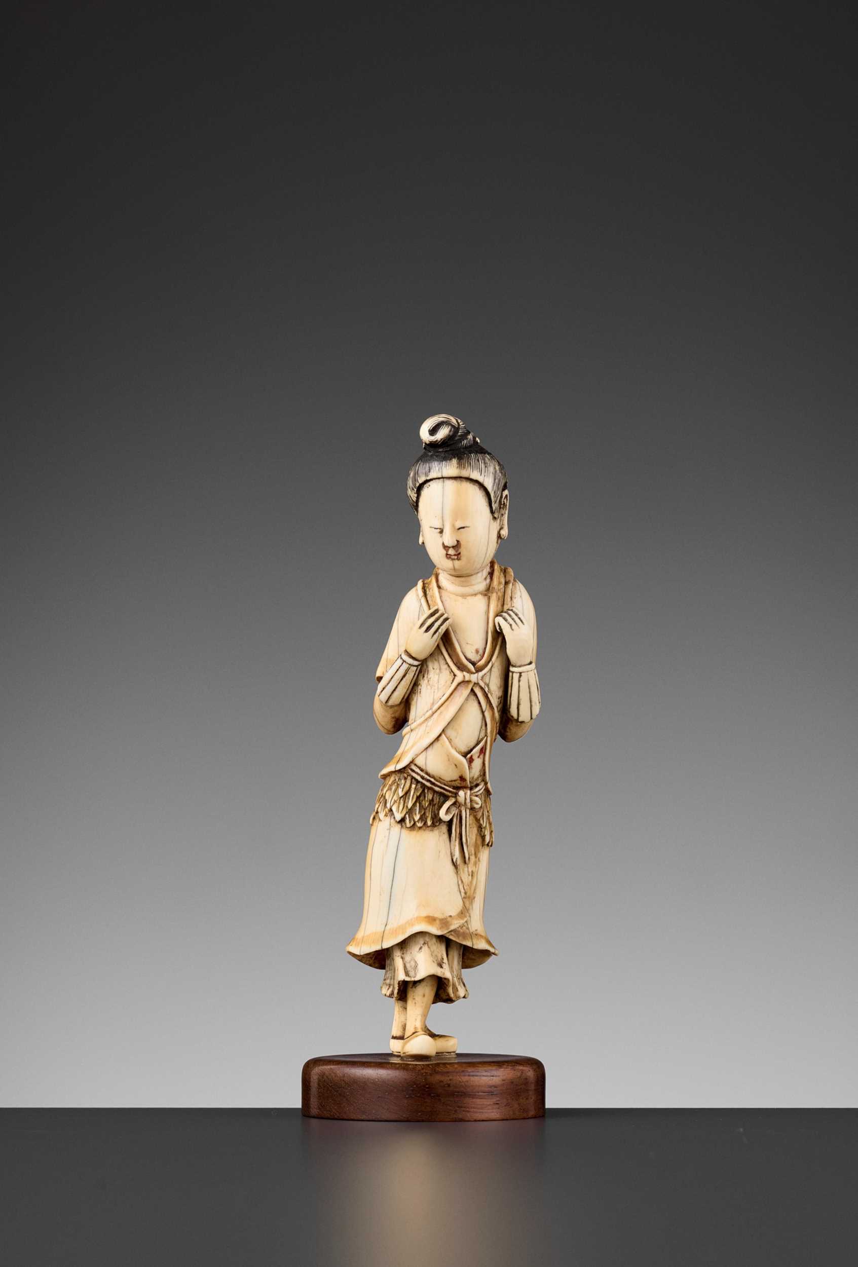 Lot 469 - AN IVORY FIGURE OF A LAN CAIHE, MING DYNASTY