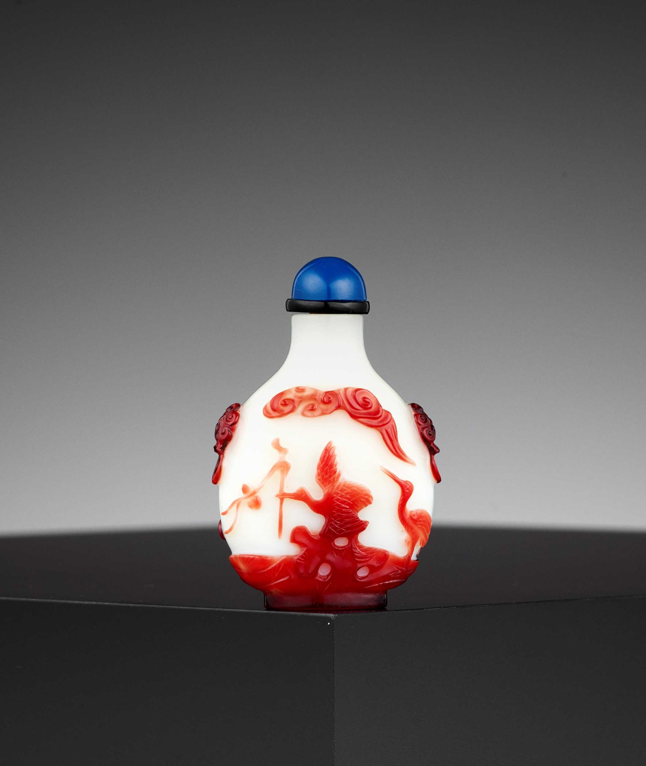 Lot 319 - A RUBY-RED OVERLAY ‘AUSPICIOUS’ WHITE GLASS SNUFF BOTTLE, QING DYNASTY