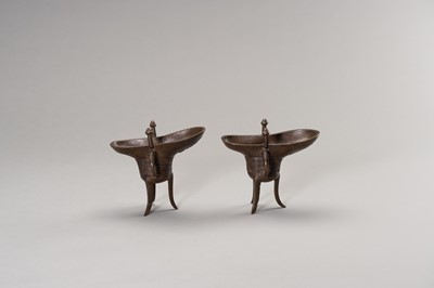 Lot 57 - A RARE PAIR OF ARCHAISTIC BRONZE JUE QIANLONG MARK AND PERIOD