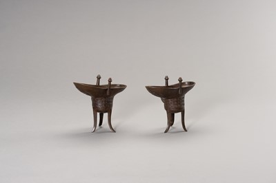 A RARE PAIR OF ARCHAISTIC BRONZE JUE QIANLONG MARK AND PERIOD