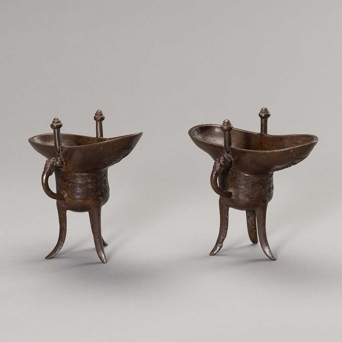 A RARE PAIR OF ARCHAISTIC BRONZE JUE QIANLONG MARK AND PERIOD