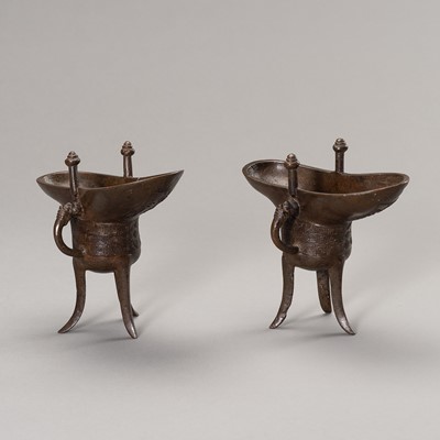 Lot 780 - A RARE PAIR OF ARCHAISTIC BRONZE JUE QIANLONG MARK AND PERIOD