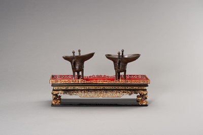 Lot 57 - A RARE PAIR OF ARCHAISTIC BRONZE JUE QIANLONG MARK AND PERIOD