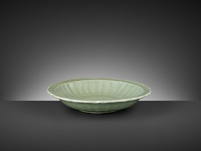 Lot 244 - A LONGQUAN CELADON BARBED-RIM CHARGER, MING DYNASTY