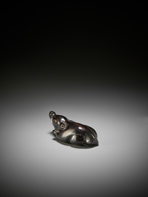 Lot 38 - A LARGE AND OLD DARK WOOD NETSUKE OF A RECUMBENT BOAR