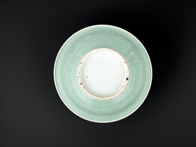 Lot 260 - A LARGE MOLDED AND INCISED CELADON-GLAZED BOWL, MID-QING