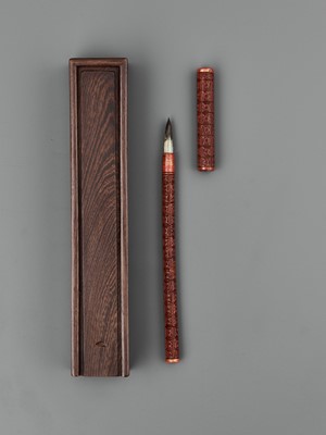 Lot 453 - A CARVED RED LACQUER BRUSH AND COVER, LATE MING DYNASTY