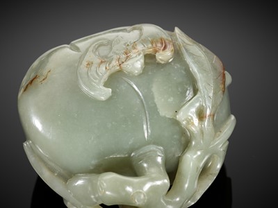 Lot 102 - A DEEP CELADON AND RUSSET JADE ‘PEACH AND BAT’ GROUP, EARLY QING DYNASTY