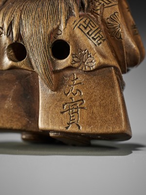 Lot 187 - HOJITSU: A WOOD NETSUKE OF A NOH ACTOR IN THE ROLE OF HANNYA