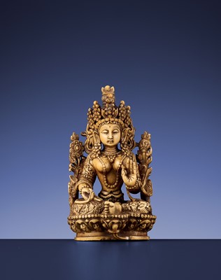 Lot 403 - A CARVED IVORY FIGURE OF THE GREEN TARA