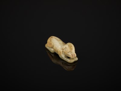 Lot 85 - A CELADON AND RUSSET JADE FIGURE OF A DOG, SONG TO MING DYNASTY