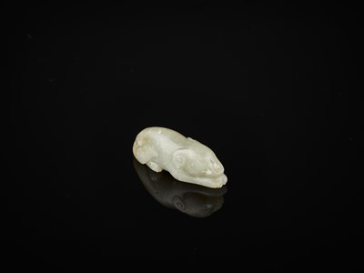 Lot 84 - A PALE CELADON AND RUSSET JADE FIGURE OF A DOG, SONG TO YUAN DYNASTY