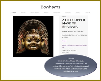 Lot 418 - A GILT BRONZE MASK OF BHAIRAVA, 16TH-17TH CENTURY