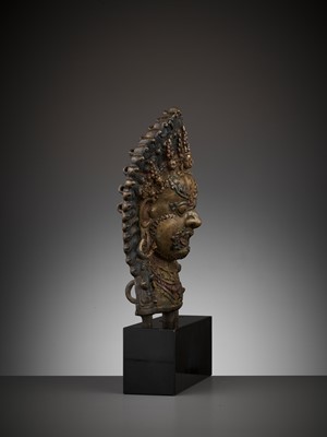 Lot 418 - A GILT BRONZE MASK OF BHAIRAVA, 16TH-17TH CENTURY