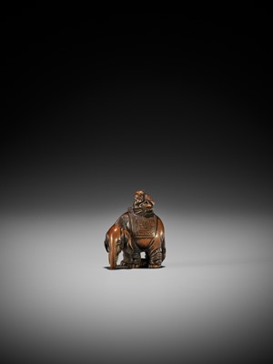 Lot 244 - HOSHUNSAI MASAYUKI: A RARE WOOD NETSUKE OF A FOREIGNER RIDING AN ELEPHANT