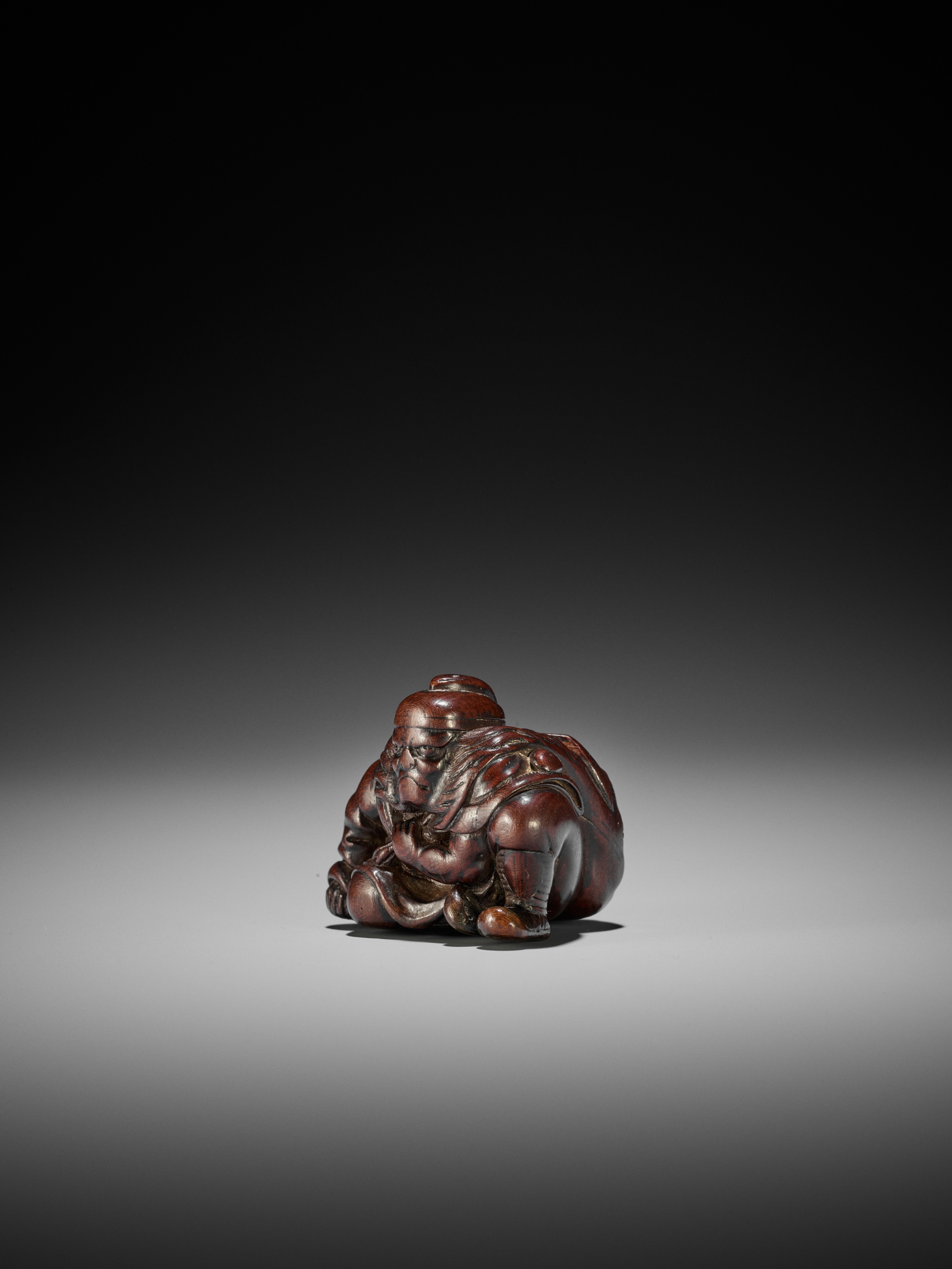 Lot 152 - JUGYOKU I: A RARE AND SUPERB WOOD NETSUKE OF