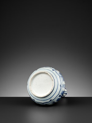 Lot 201 - A MOLDED BLUE AND WHITE GARLIC-MOUTH VASE, WANLI PERIOD