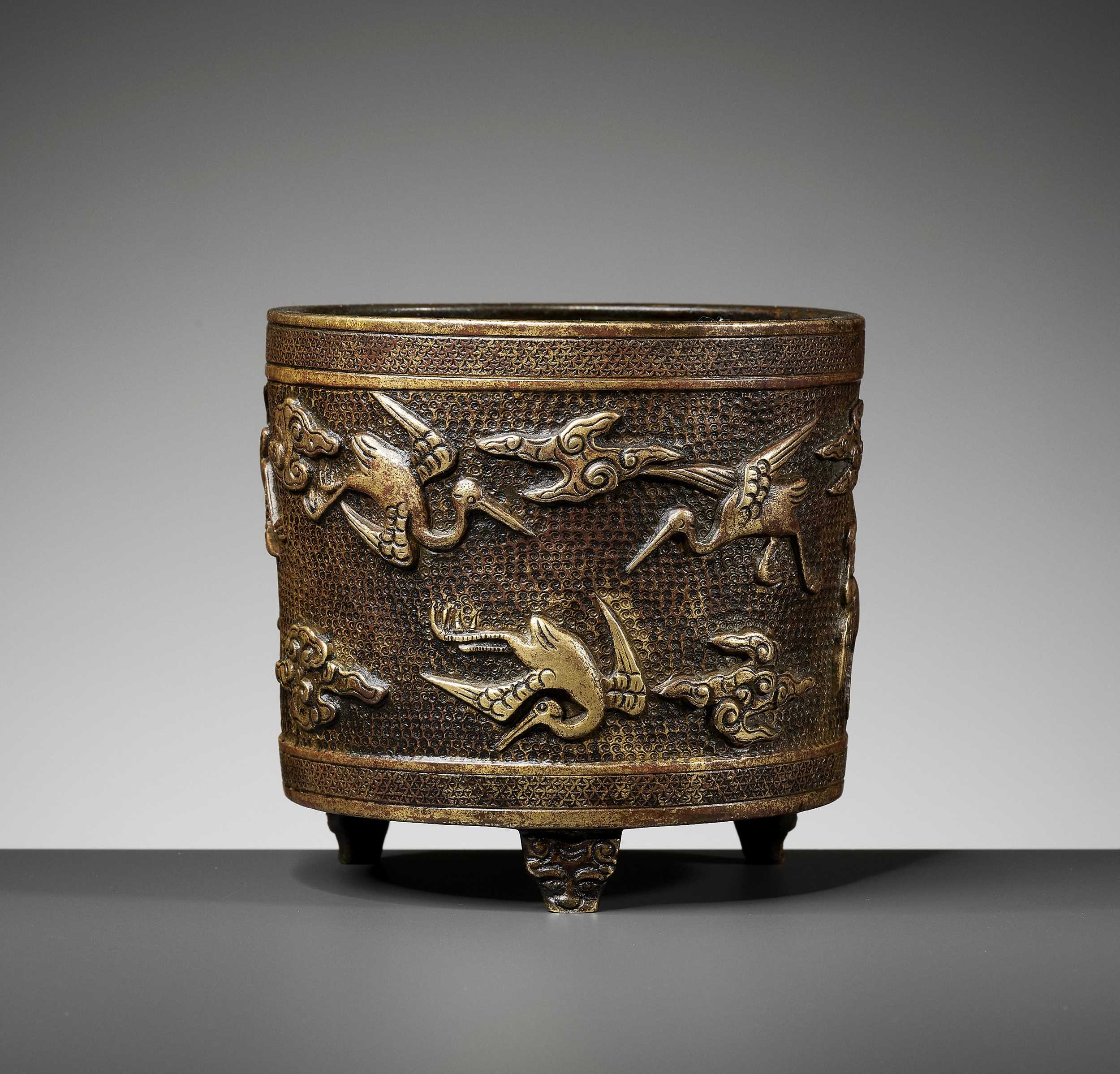 Lot 367 A HU WENMING PARCEL GILT TRIPOD CENSER MING lot-367-a-hu-wenming-parcel-gilt-tripod-censer-ming