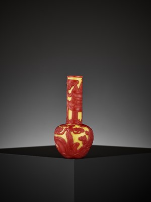 Lot 18 - A CARVED RED-OVERLAY YELLOW GLASS BOTTLE VASE, QIANLONG MARK AND PERIOD