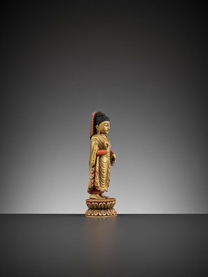 Lot 86 - A TIBETAN-CHINESE PAINTED AND GILT IVORY FIGURE OF BUDDHA, LATE MING TO EARLY QING DYNASTY