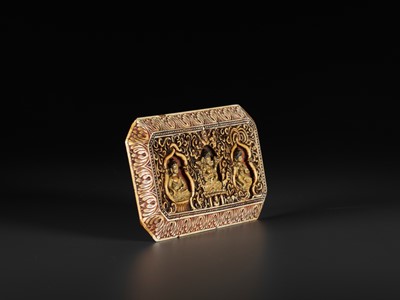 Lot 397 - A CARVED IVORY ‘BUDDHIST TRIAD’ MANUSCRIPT COVER, 17TH CENTURY