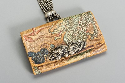 Lot 629 - A LEATHER TABAKO-IRE SET WITH DRAGON DECOR