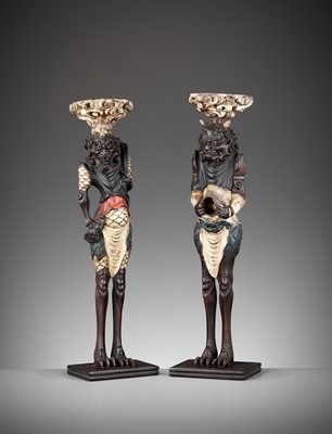 Lot 357 - A PAIR OF PAINTED AND LACQUERED WOOD FIGURAL CANDLESTICKS DEPICTING ONI