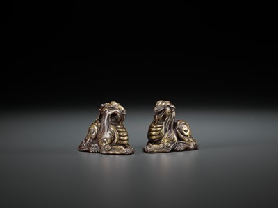 Lot 361 - A PAIR OF GILT BRONZE ‘MYTHICAL BEAST’ WEIGHTS, EASTERN ZHOU TO WESTERN HAN