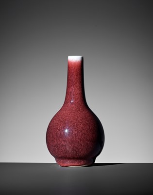 Lot 230 - A SMALL COPPER-RED GLAZED BOTTLE VASE, QING DYNASTY