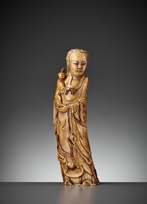 Lot 990 - AN IVORY FIGURE OF GUANYIN AND CHILD, LATE MING DYNASTY