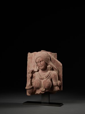 Lot 585 - A PINK SANDSTONE RELIEF DEPICTING A SHALABHANJIKA, MATHURA, SHUNGA PERIOD