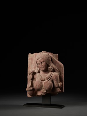 Lot 585 - A PINK SANDSTONE RELIEF DEPICTING A SHALABHANJIKA, MATHURA, SHUNGA PERIOD