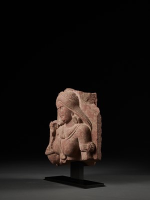 Lot 585 - A PINK SANDSTONE RELIEF DEPICTING A SHALABHANJIKA, MATHURA, SHUNGA PERIOD