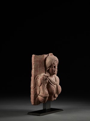 Lot 585 - A PINK SANDSTONE RELIEF DEPICTING A SHALABHANJIKA, MATHURA, SHUNGA PERIOD
