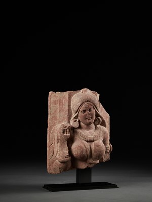 Lot 585 - A PINK SANDSTONE RELIEF DEPICTING A SHALABHANJIKA, MATHURA, SHUNGA PERIOD
