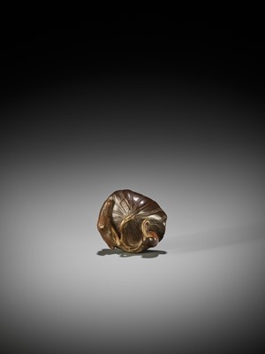 Lot 85 - TOMONOBU: A RARE LACQUERED WOOD NETSUKE OF A GOLDEN FROG ON A LOTUS LEAF