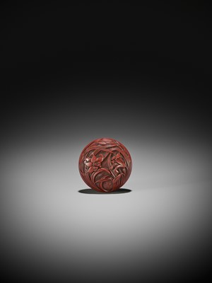Lot 306 - A FINE TSUISHU (CARVED RED LACQUER) MANJU NETSUKE WITH LILIES