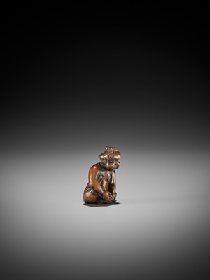Lot 147 - A CHARMING OLD WOOD NETSUKE OF OKAME CLIPPING HER TOENAILS