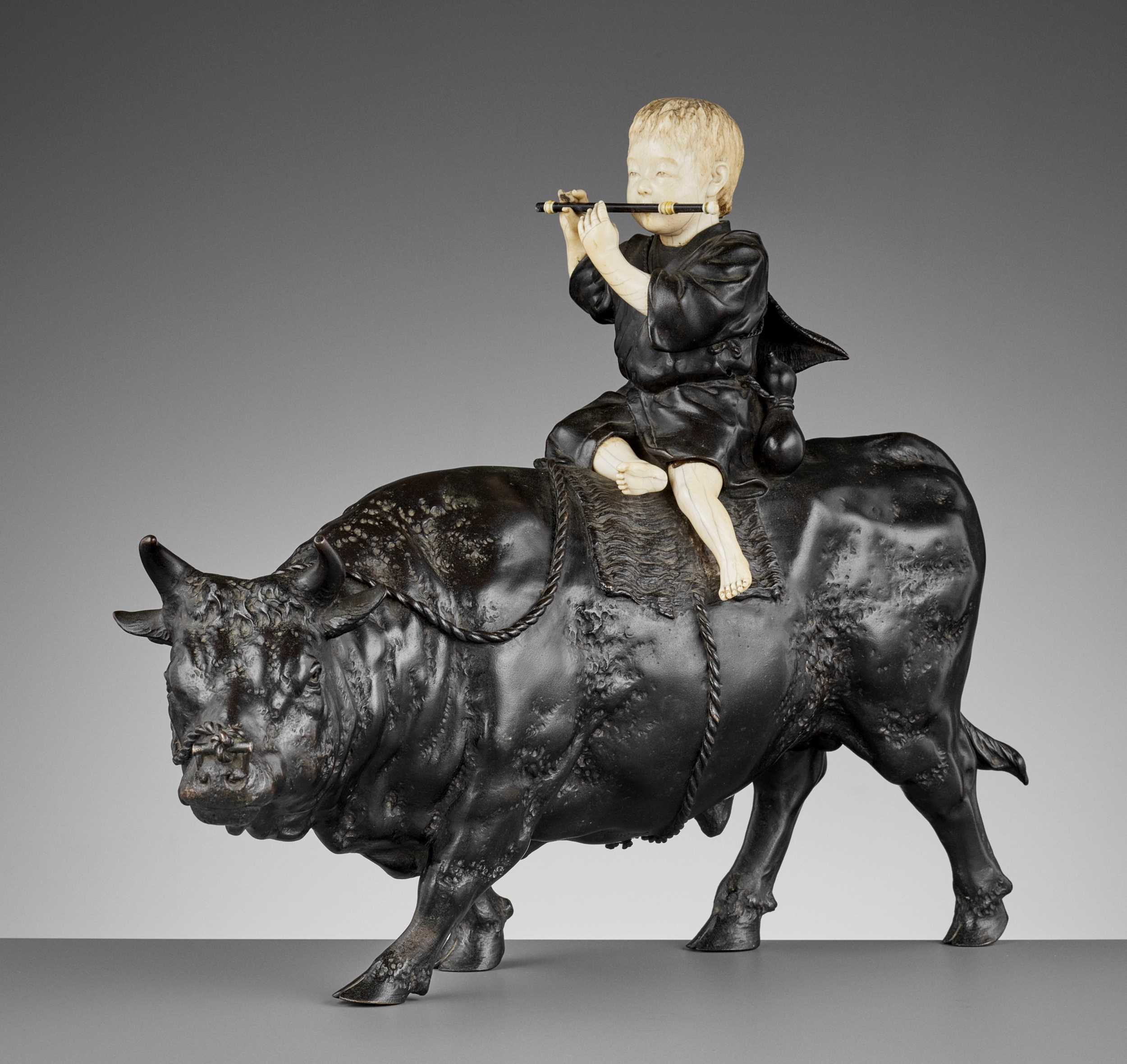 Lot 14 - KIMURA HARUMITSU: A SUPERB AND MASSIVE IVORY AND BRONZE TOKYO SCHOOL OKIMONO OF AN OX HERDER WITH OX